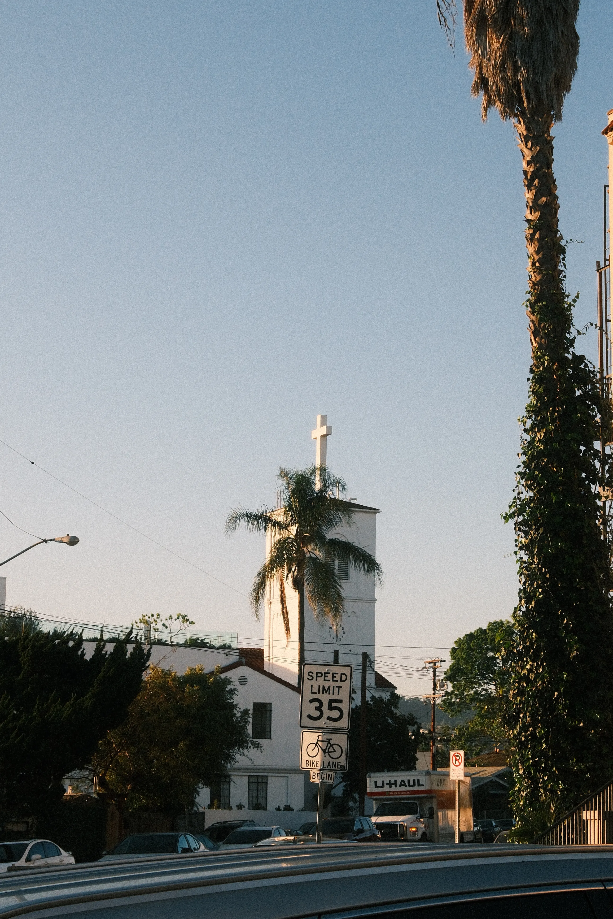 White church with cross against evening sky